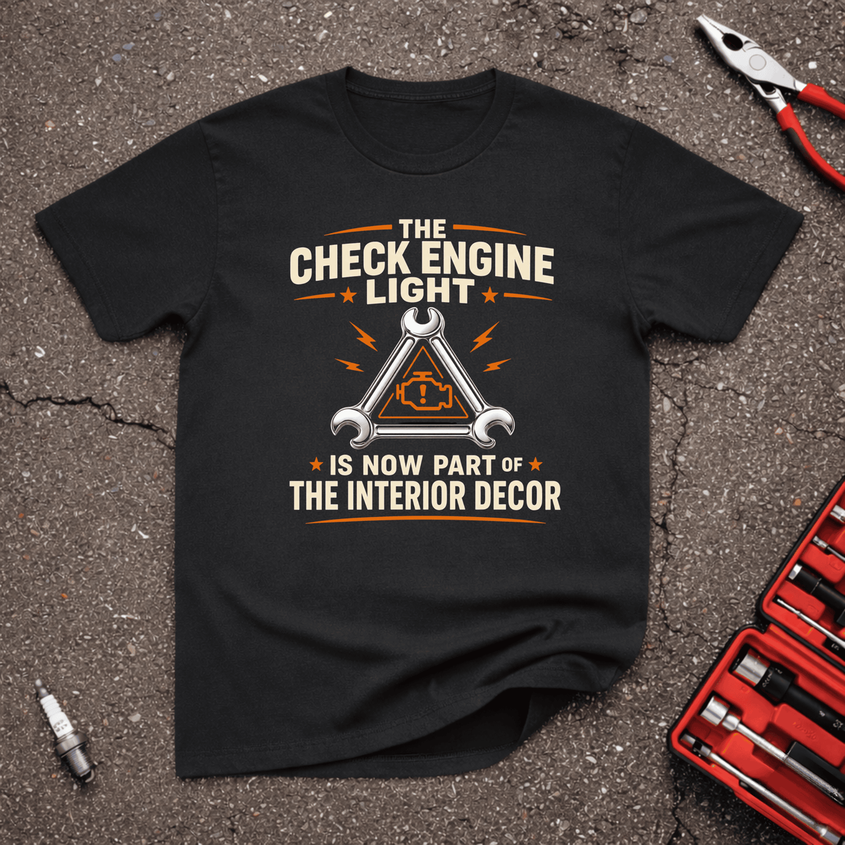 The Check Engine Light Is Now Part of the Interior Decor funny gearhead t-shirt on black tee with wrench triangle warning symbol — GarageGiggles automotive humor apparel