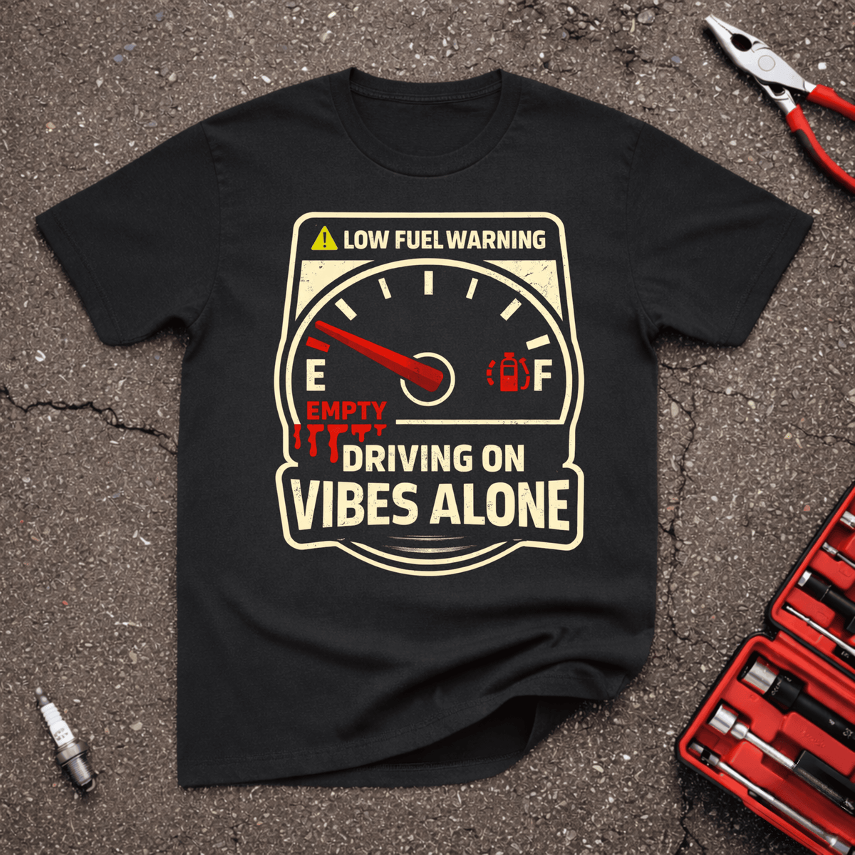 Vibes Alone funny automotive t-shirt with empty fuel gauge, red warning light and Driving On Vibes Alone text on black shirt.