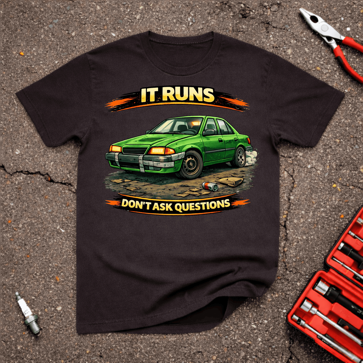 Don't Ask Questions funny automotive T-shirt showing worn green beater sedan with smoke behind it and text reading It Runs Don't Ask Questions on Dark Chocolate shirt.