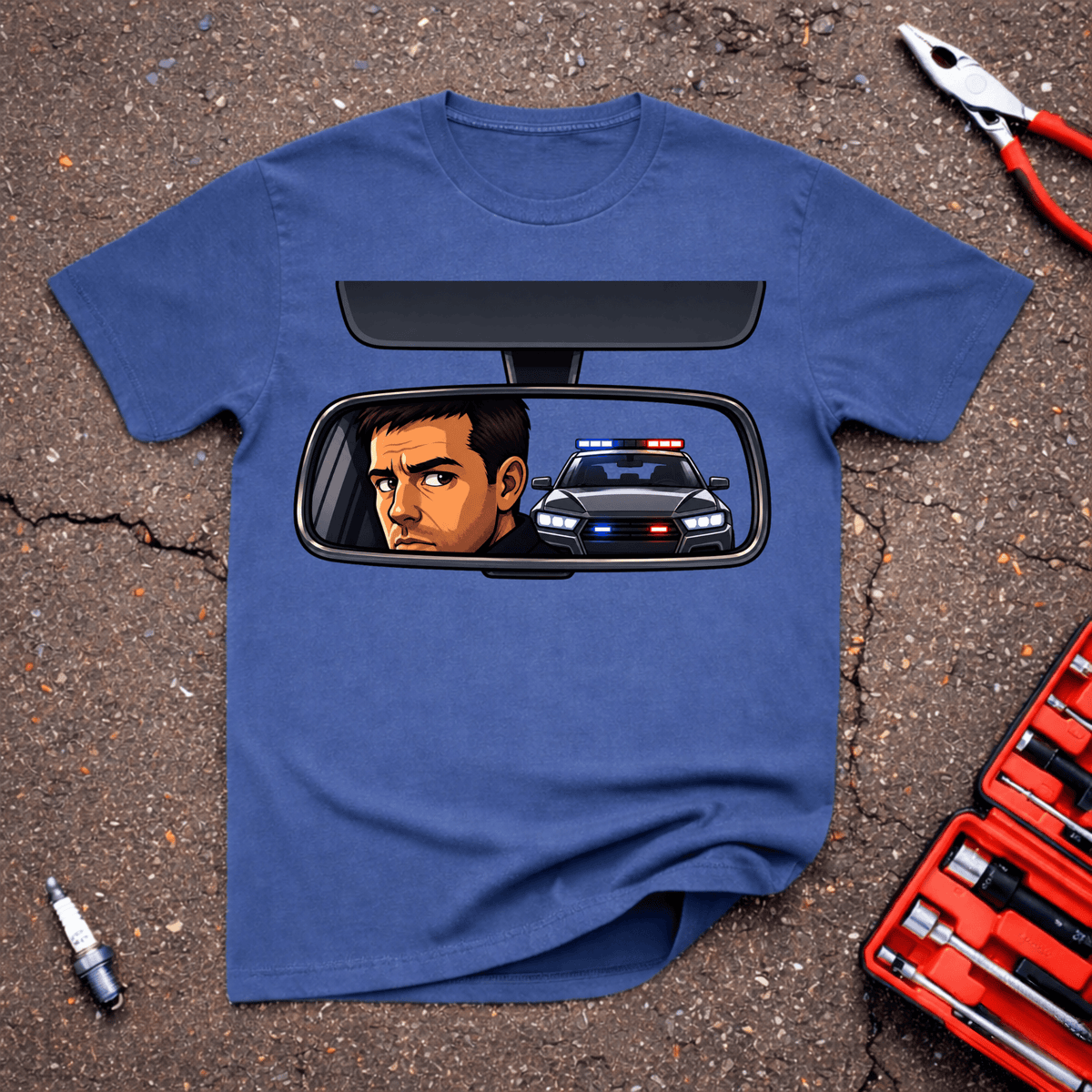 Garage Giggles Pulled Over T-Shirt showing a worried driver in a rearview mirror with a police car and flashing red and blue lights behind him.