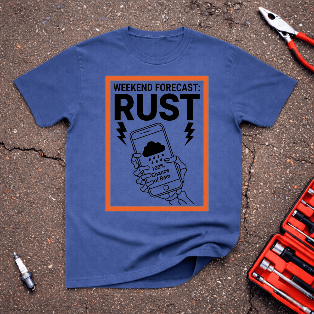 Forecast Rust funny automotive T-shirt with Weekend Forecast Rust text, skeleton hands holding phone showing 100 percent chance of rain, orange border on heather indigo shirt.