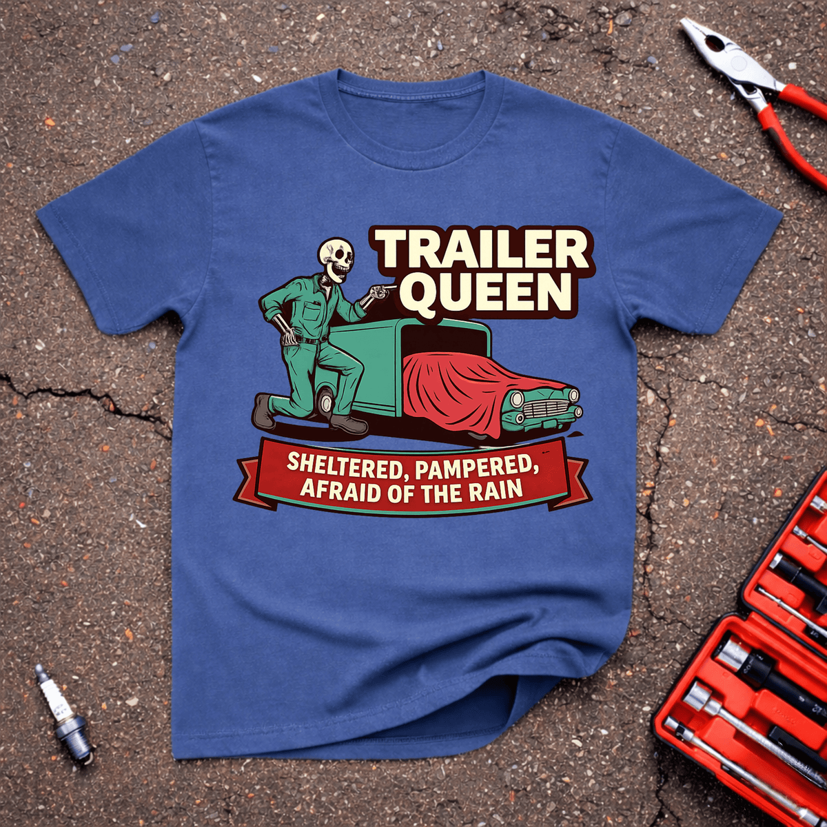 Trailer Queen funny car show T-shirt with skeleton mechanic beside a covered classic car and Sheltered Pampered Afraid of the Rain text on heather indigo.