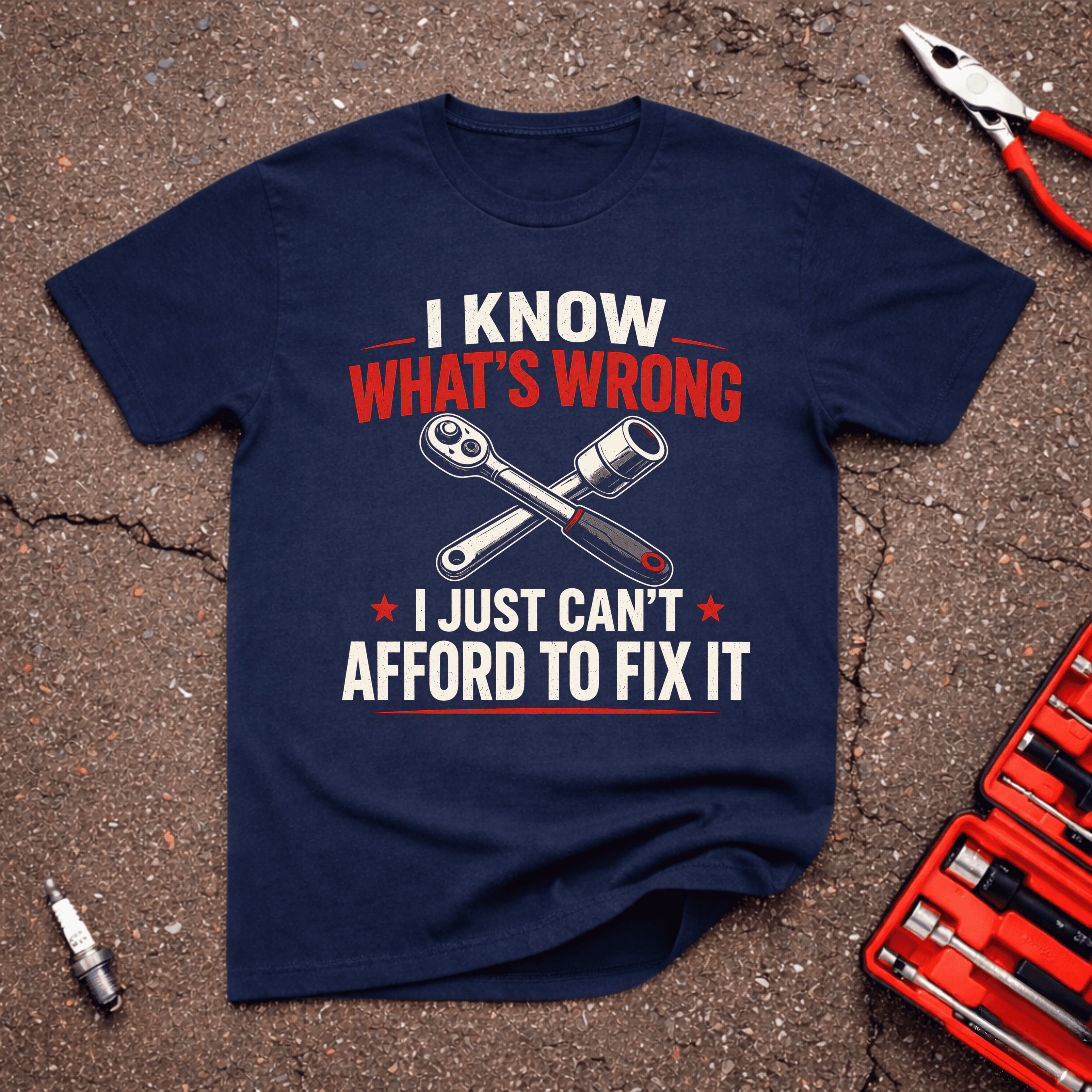 I Know What's Wrong I Just Can't Afford To Fix It funny mechanic budget t-shirt on navy tee with crossed ratchet tools — GarageGiggles automotive humor apparel
