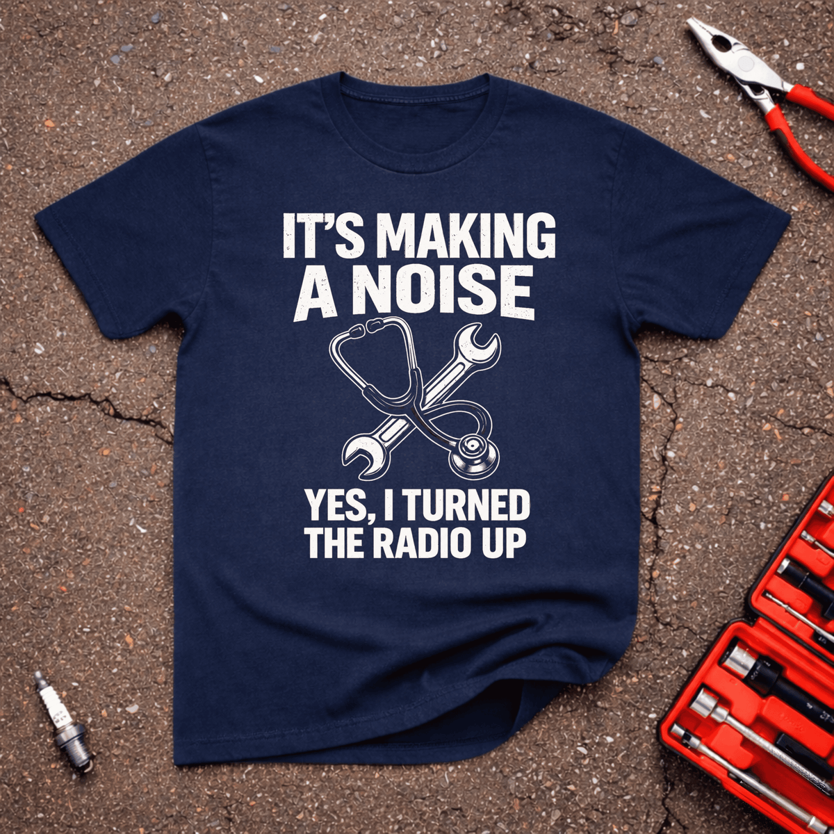 Turn The Radio Up funny automotive T-shirt with a wrench and stethoscope and text reading It’s Making A Noise Yes I Turned The Radio Up on navy shirt.