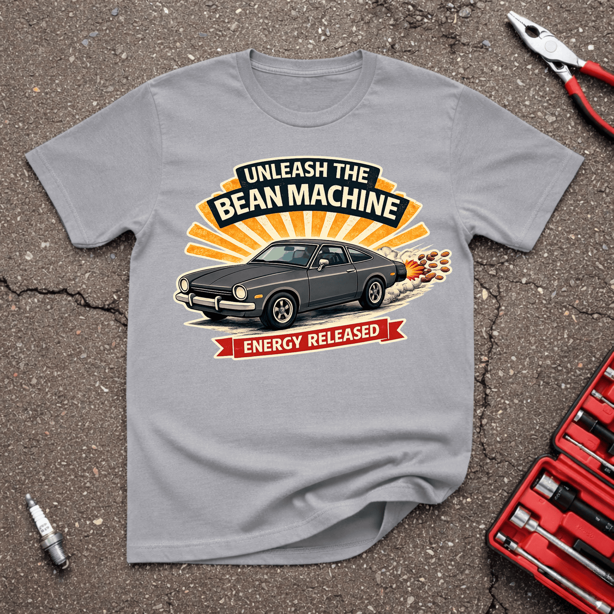 Energy Released funny automotive T-shirt with classic performance car launching hard and text Unleash The Bean Machine Energy Released on Sport Grey shirt.