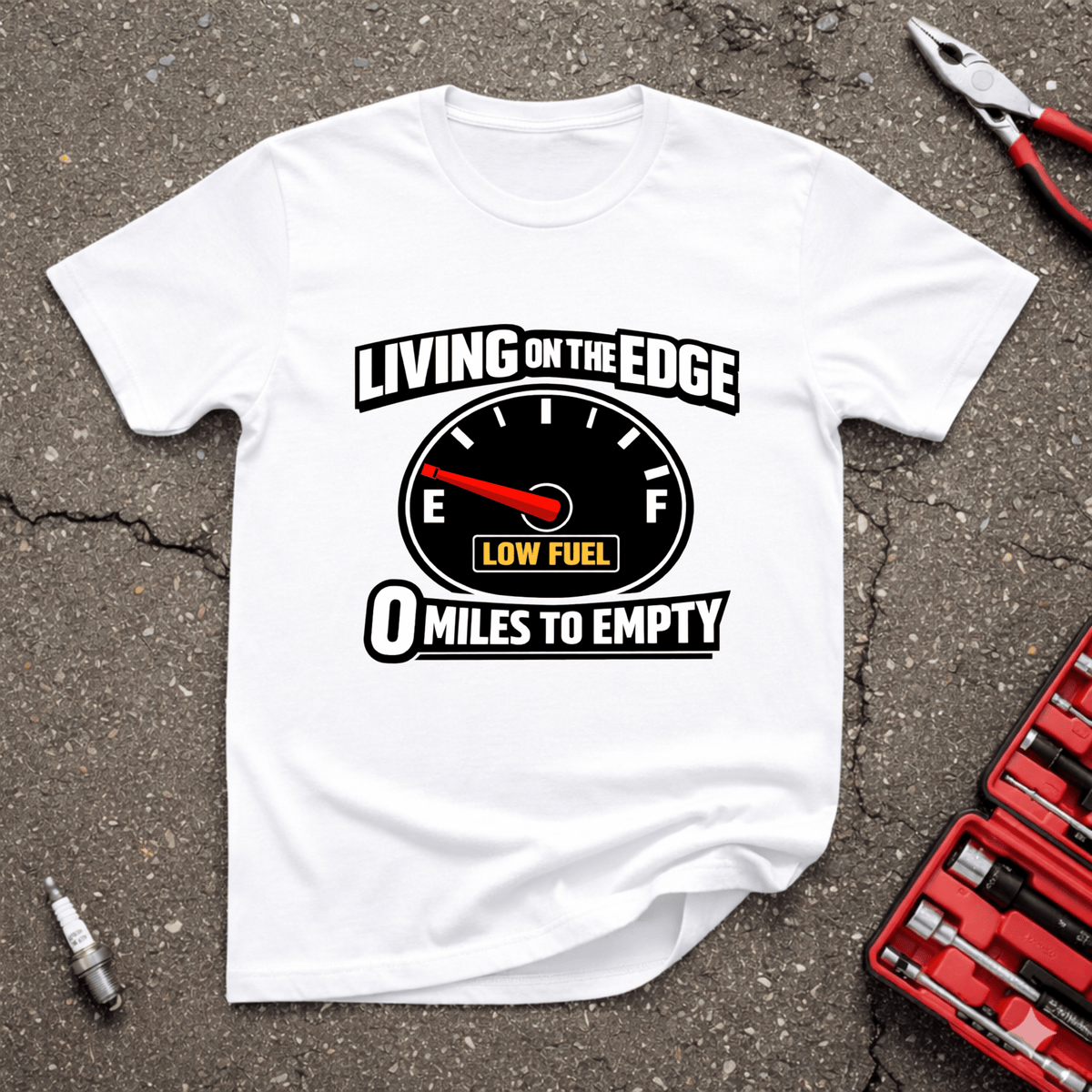 Living On The Edge funny automotive T-shirt with fuel gauge near empty, low fuel warning, and 0 miles to empty text on white shirt.